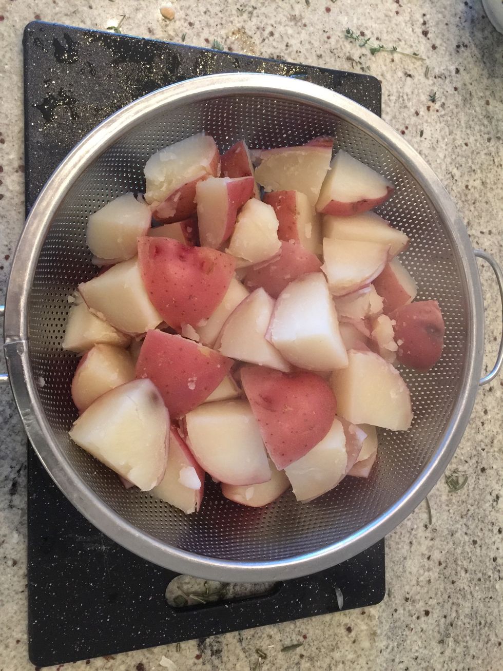 Once potatoes are soft (20-30 min) drain the water