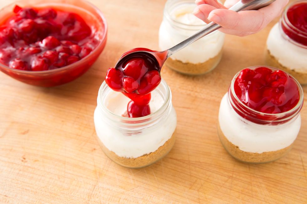 Once properly chilled, spoon cherry pie filling on top of the cream cheese mixtures.