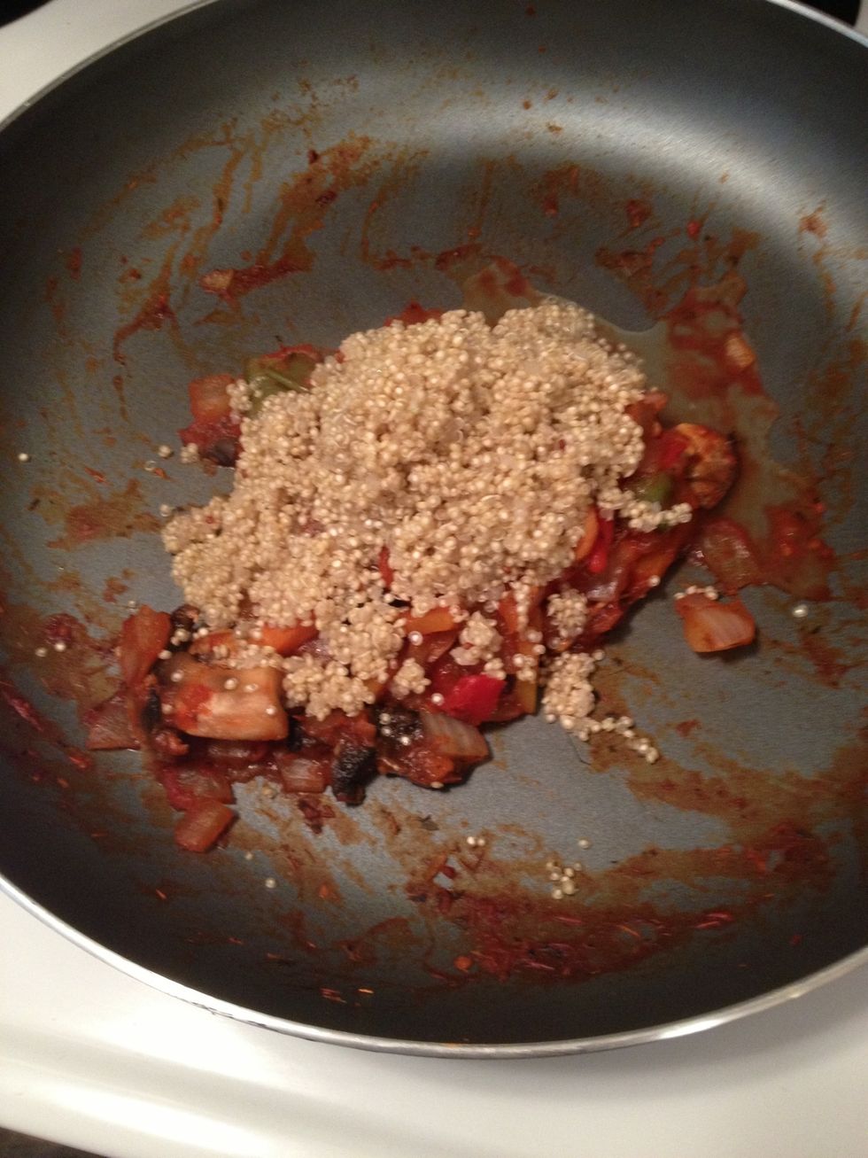 Once quinoa is cooked put over topic veggies and mix all together! I added a bit of pepper to this one just to try it out!