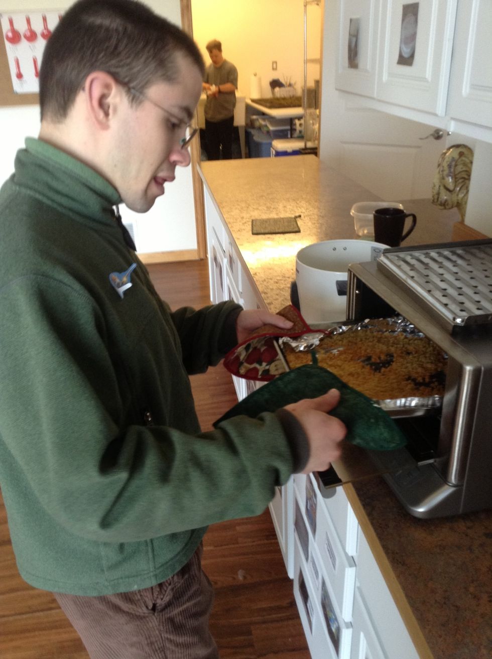 Once quinoa is done toasting remove from oven using pot holders