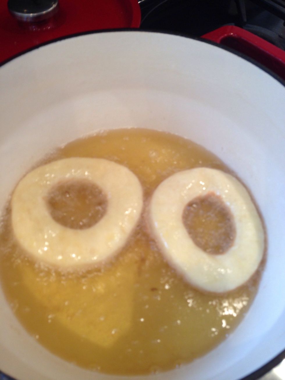 Once risen lower carefully into hot oil (I use rapeseed) at 130\u00b0C and turn once until golden brown all over