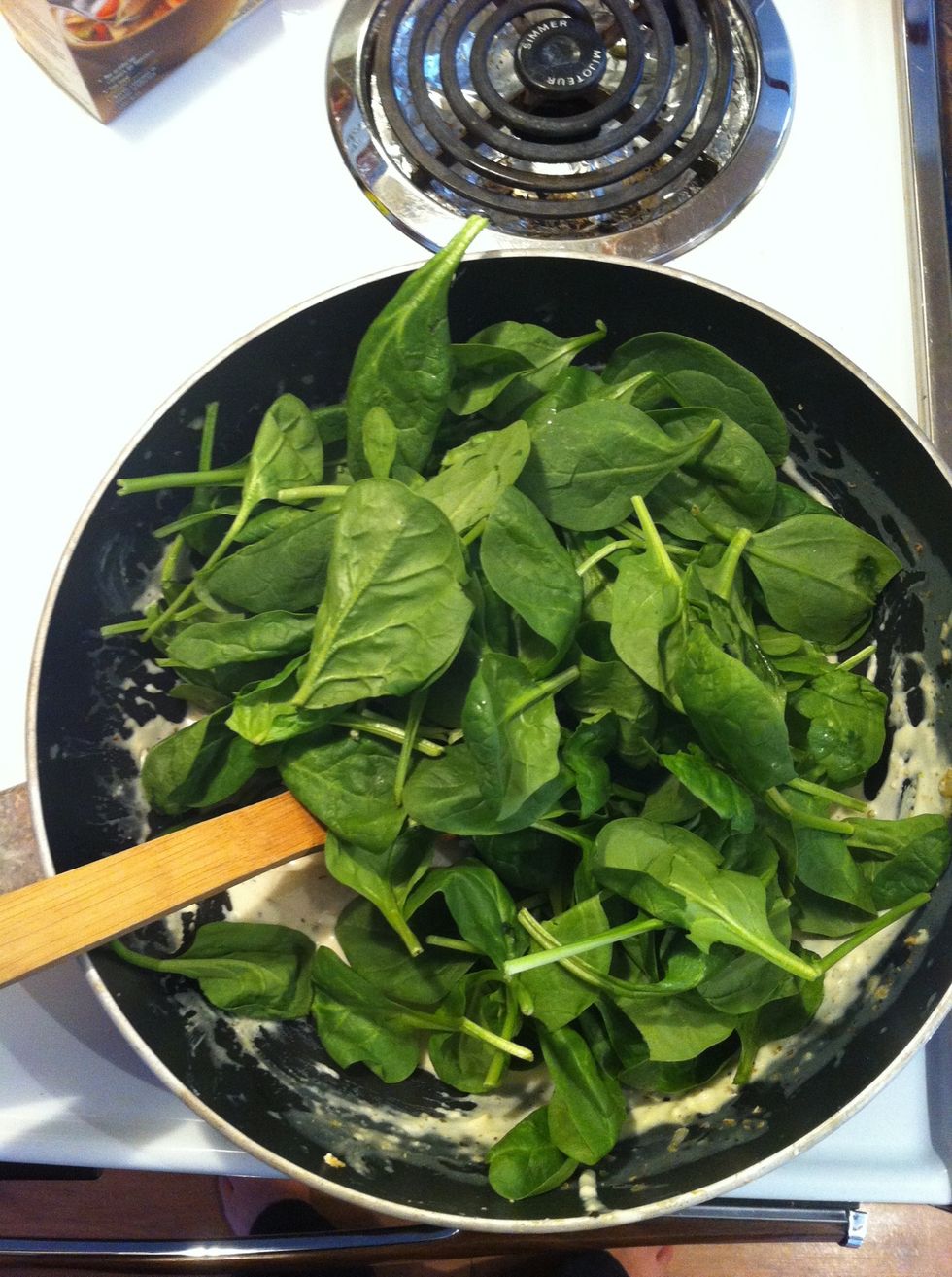 Once sauce is perfect, add spinach. Spinach shrinks ALOT so if you like it, use three large handfuls. (might need a bit more broth)