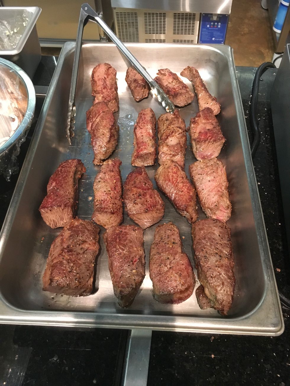 Once seared, place ribs in large pan evenly spaced.