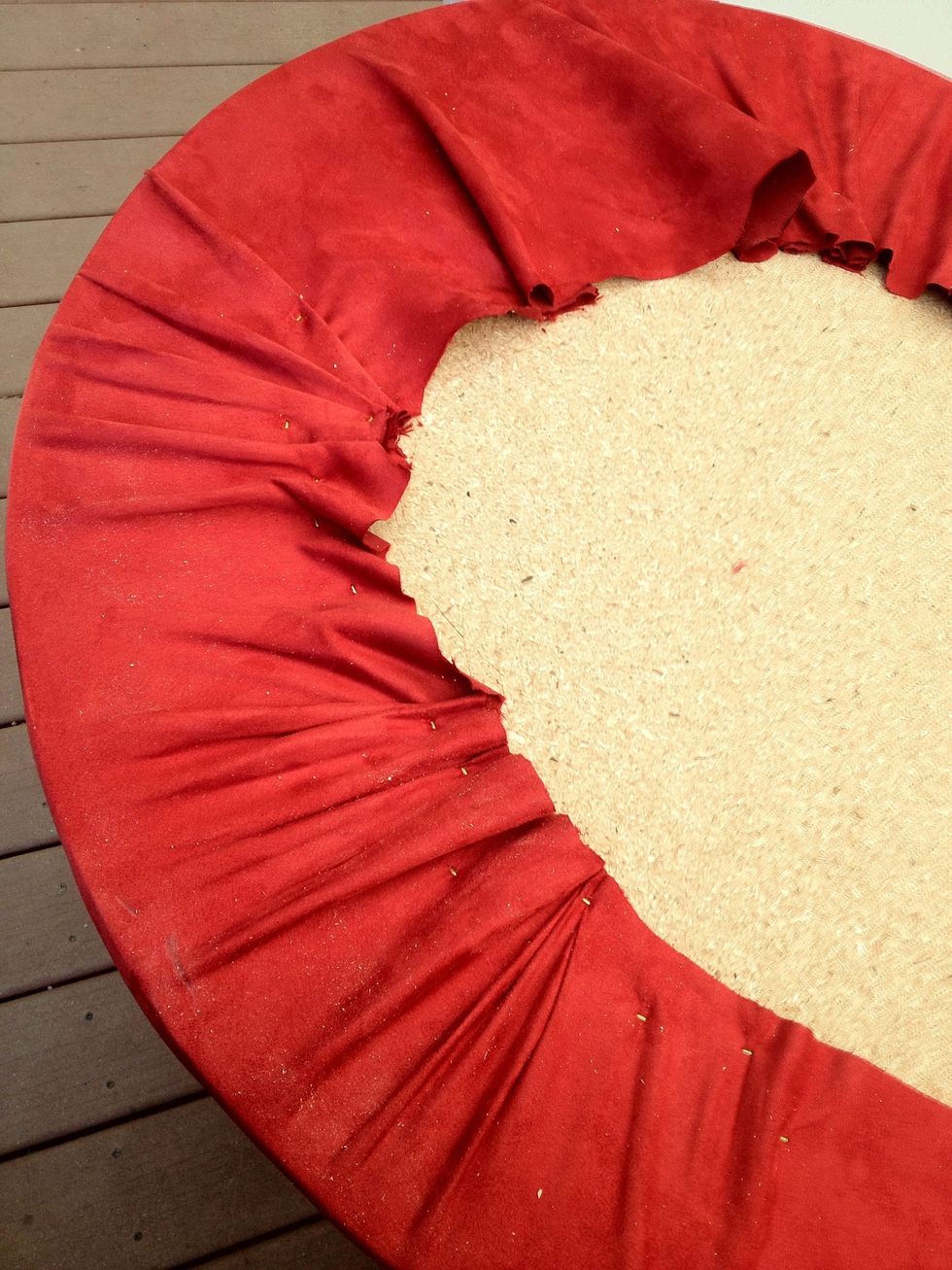 Once secured around the whole table, cut off the excess very close to the staples. Note the gathering and bunching never spills over to the playing surface. ,