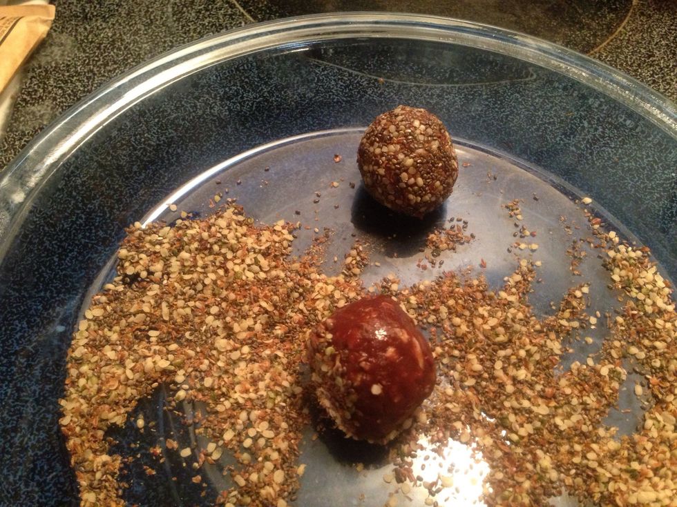 Once seed mixture is stirred well, roll each bite in the mixture to fully cover each with seeds