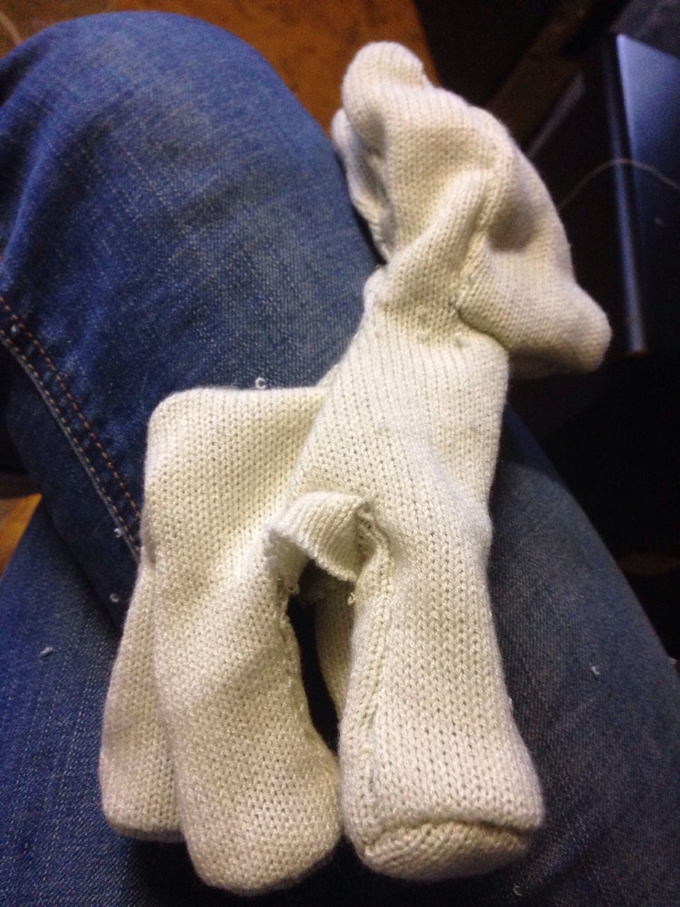 Once sewing is complete, cut a line down the middle of the underbelly so that you can turn the plushie inside out, it should now look like this.