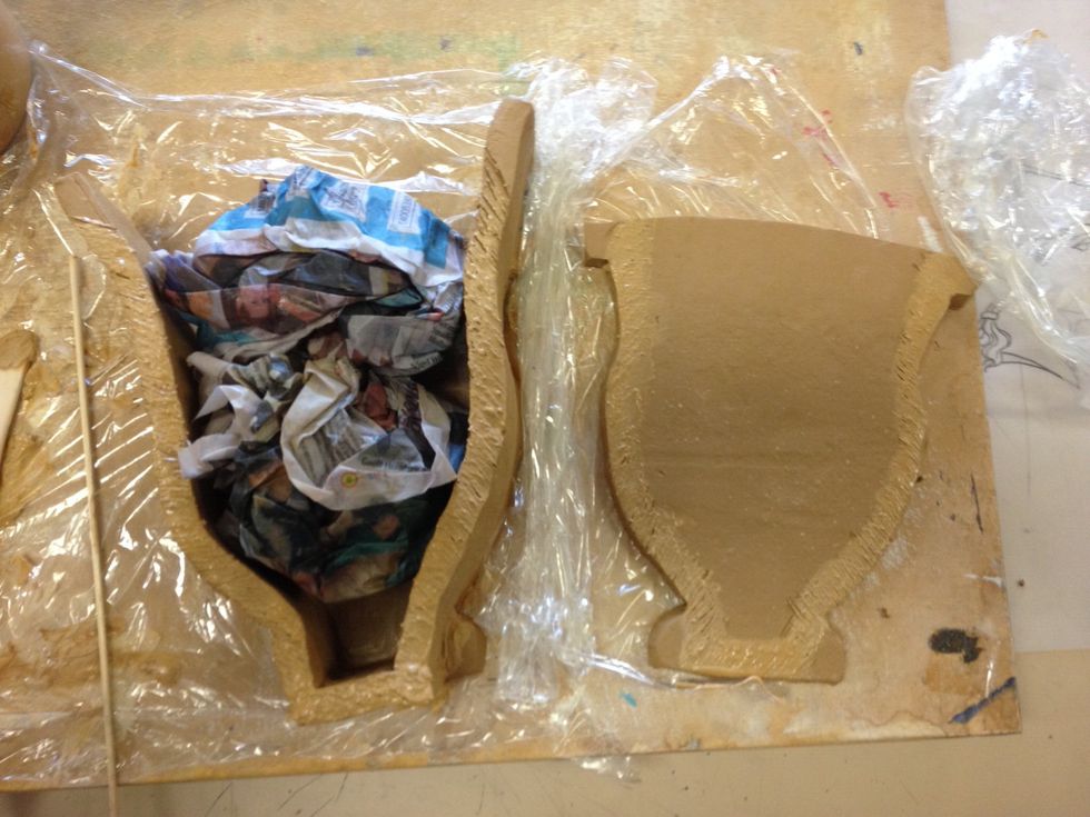 Once sides and base are joined to one template, fill the cavity with damp newspaper. This will stop the last piece sagging whilst being joined and decorated.