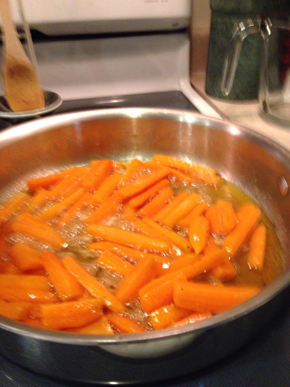 Once simmering, reduce heat to medium-low, cover and braise, stirring occasionally, until carrots are fork tender, about 20-25 minutes.
