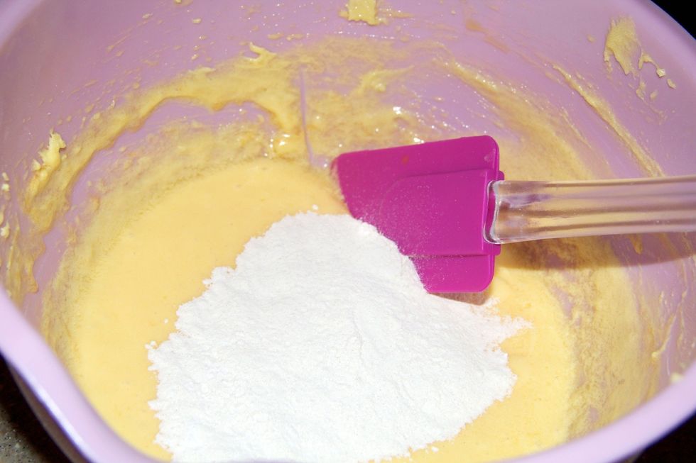 Once smooth fold in the flour one third at a time. I also added baking powder.