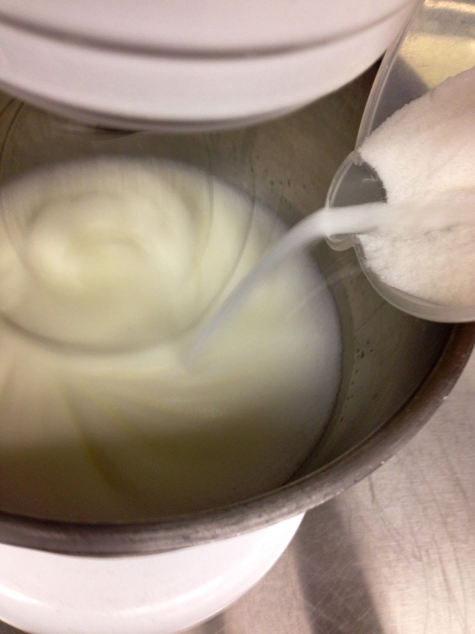 Once soft peaks form, on medium low speed, slowly add sugar