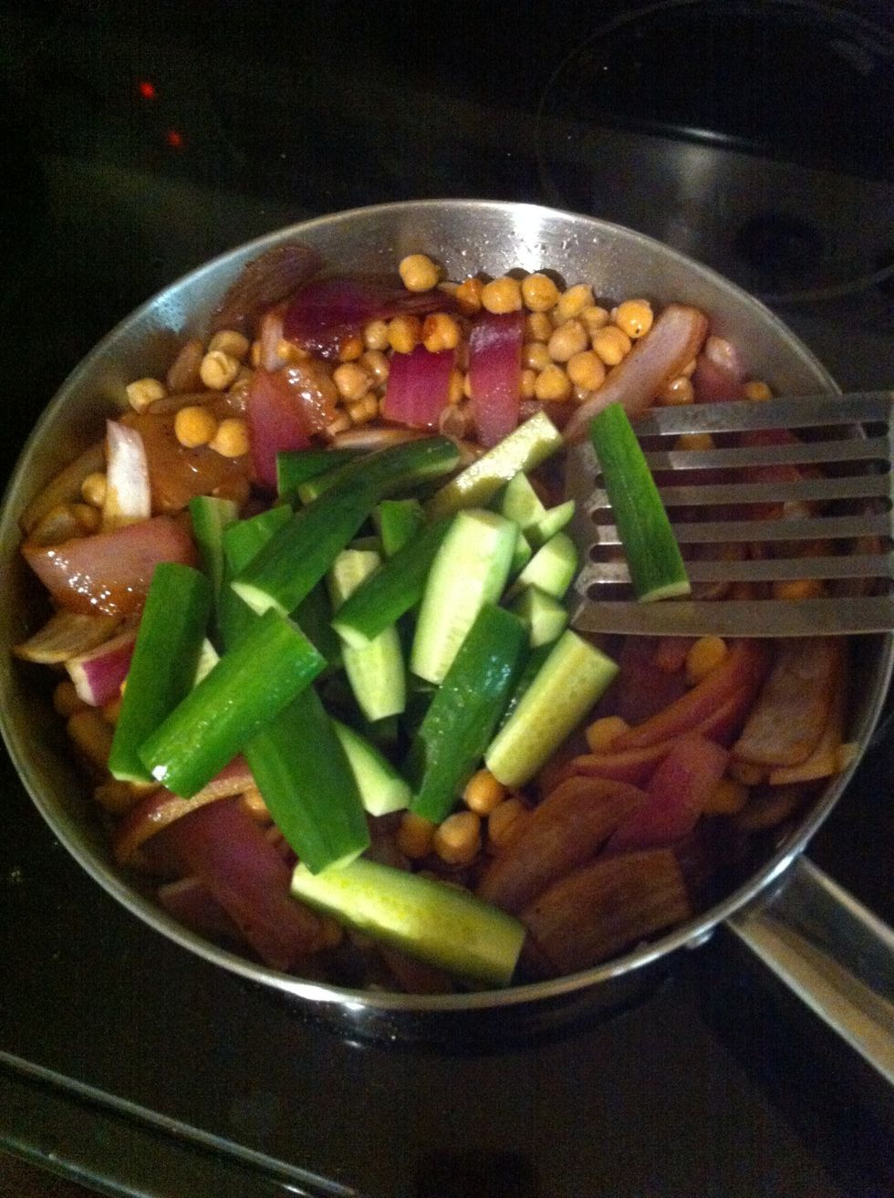 Once soy sauce reduces to about 3/4 amount, add in quartered sticks of Persian cucumber (I personally like it because it's crunchier) and stir to coat with sauce. Continue to reduce the sauce