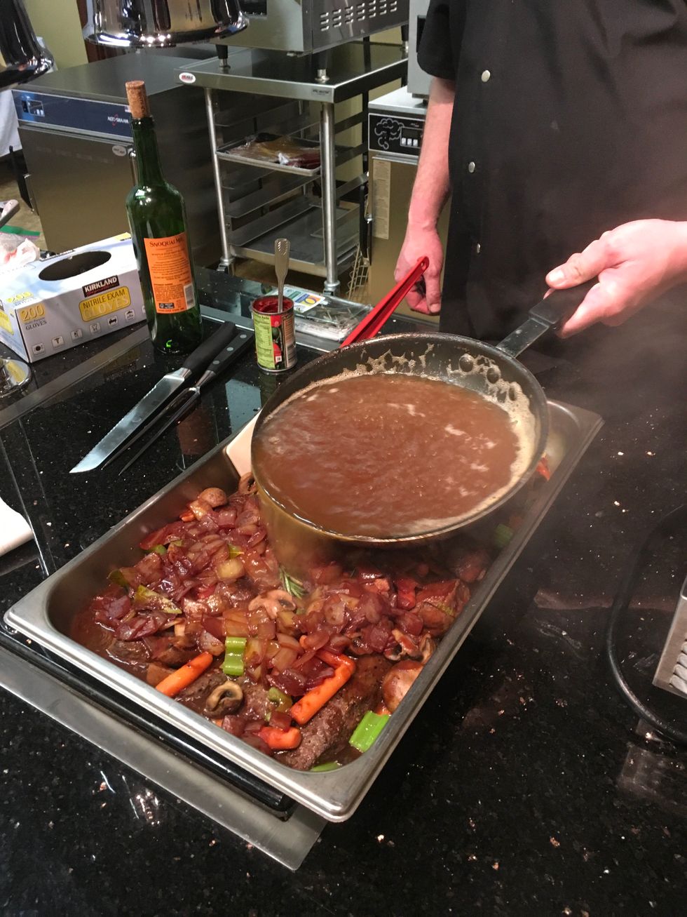 Once stock is warm, pour over beef ribs evenly.