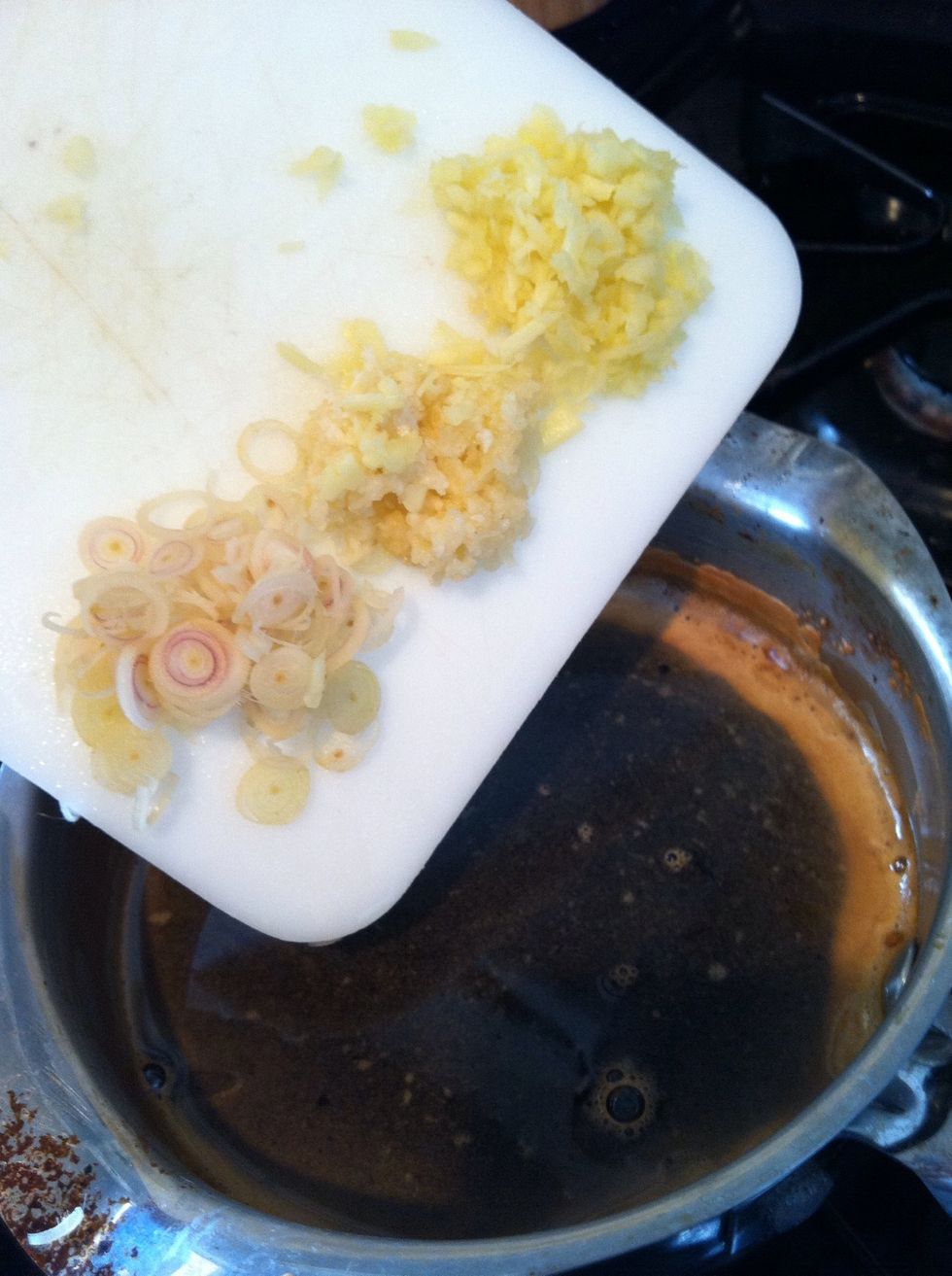 Once sugar dissolves add ginger, garlic and lemongrass. Simmer until sauce reduces by 1/4