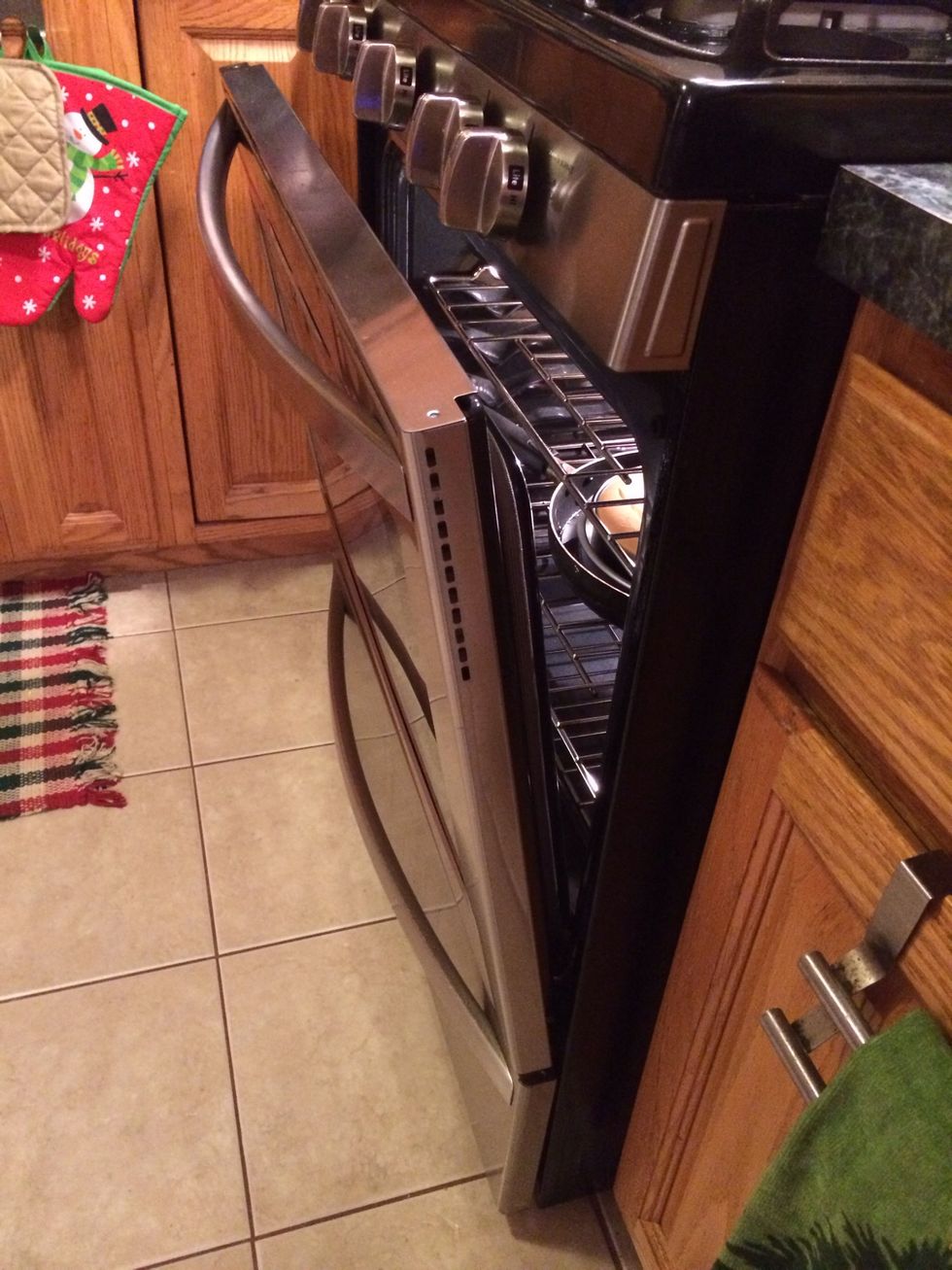 Once the 1hr and a half has passed turn off your oven and open the oven half way like I did and leave the cake in the oven another hour. Let it cool untouched and Undisturbed.