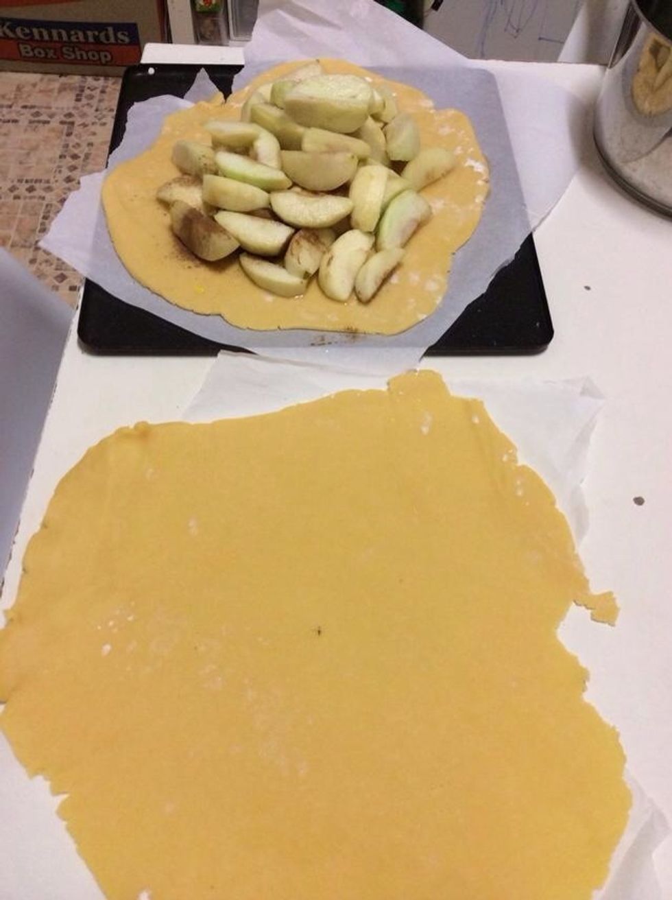 Once the apples are cooled put them onto a circle of pastry. Sprinkle 1 teaspoon of cinnamon on the apples.