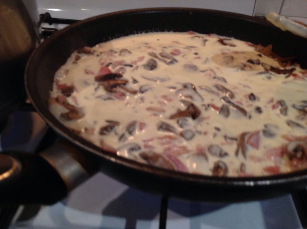 Once the bacon is cooked add mushrooms and cream and set heat to simmer