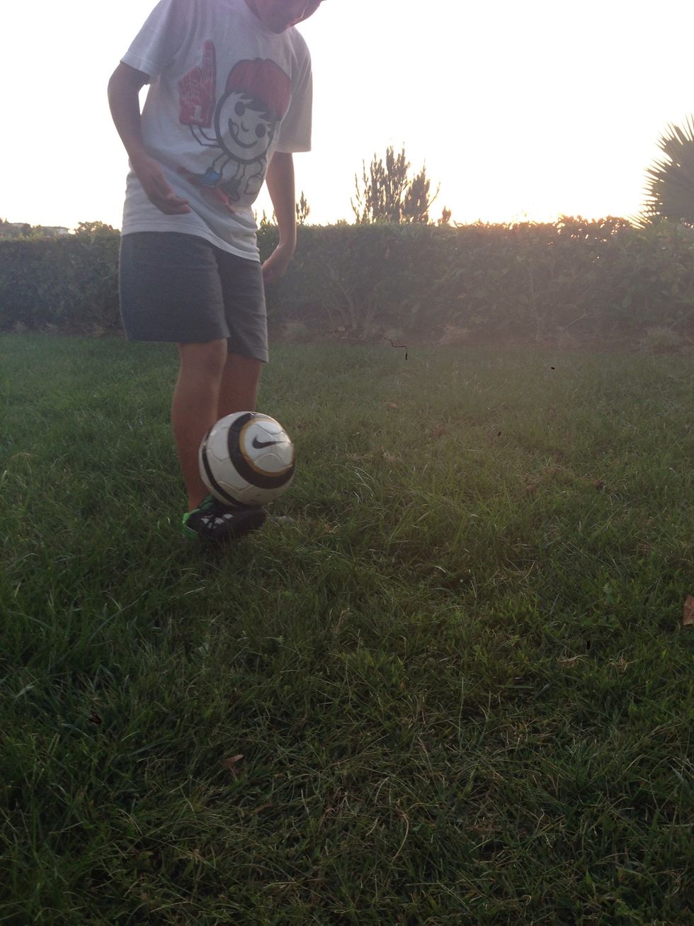 Once the ball lands on your foot, begin to juggle.