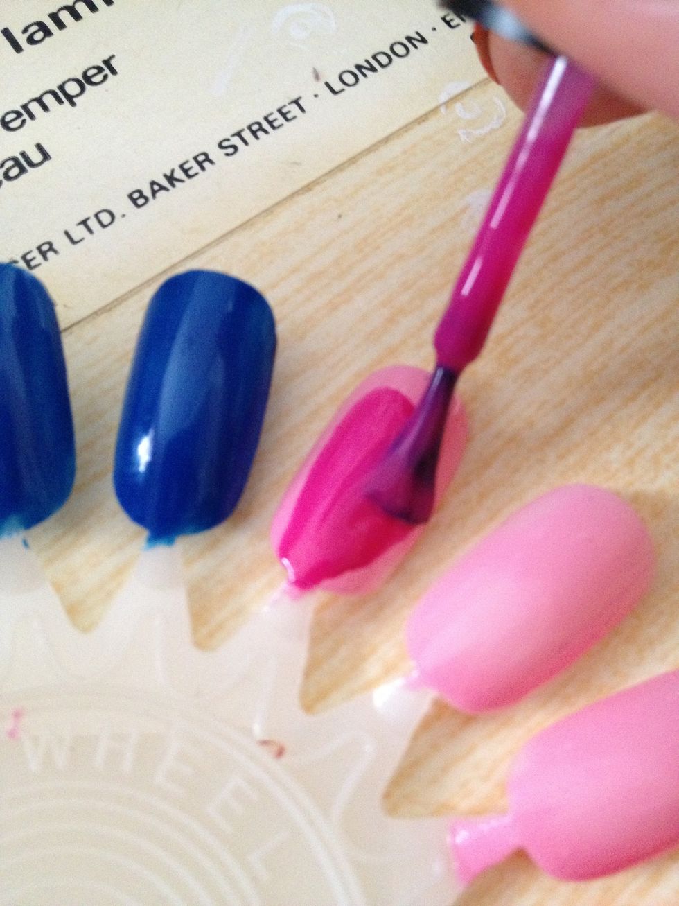 Once the base coat is dry paint your nails. I like to paint my ring finger a different colour (blue)