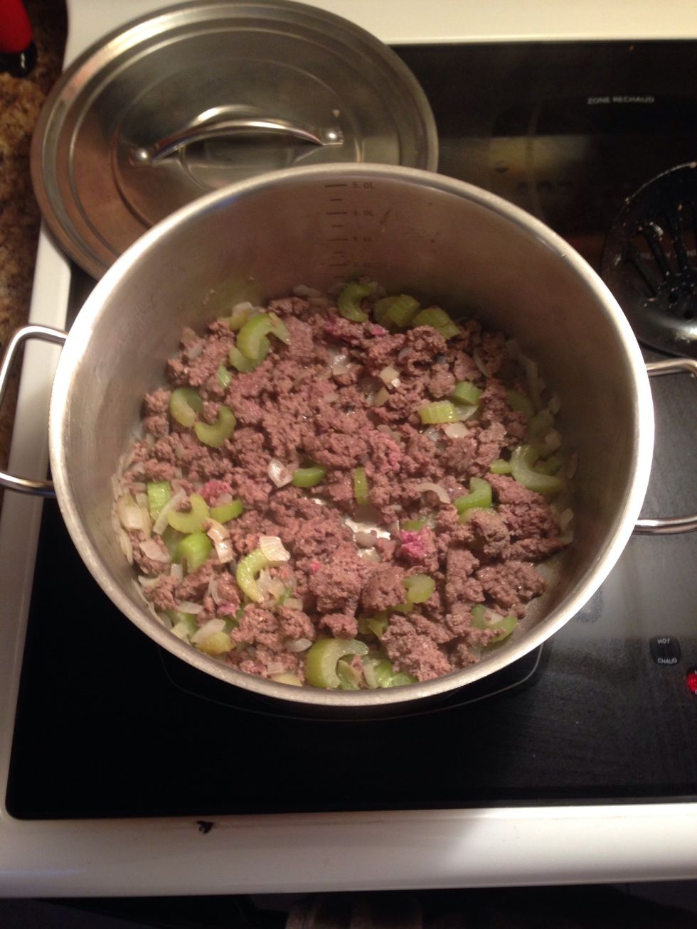 Once the beef has been completely broken apart, add the green pepper.