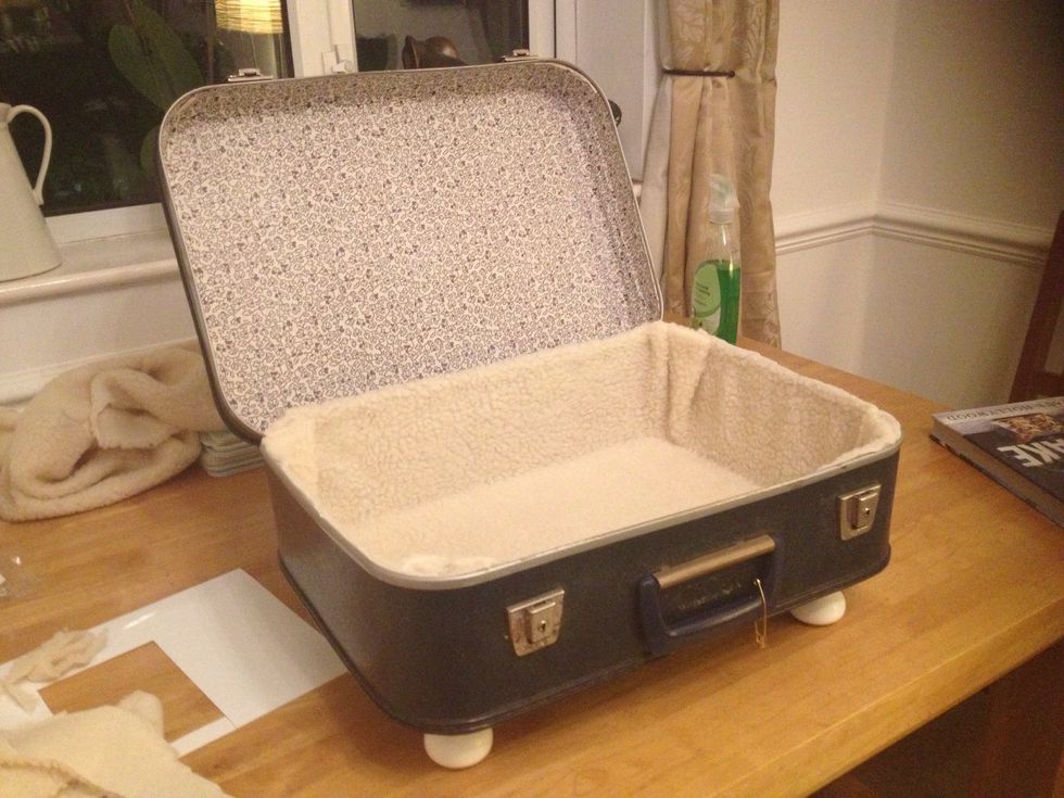 Once the bottom part is done, then glue the sides in place. Once fully dry, using scissors, carefully cut along the top. Then, using superglue, stick the door knobs underneath into place.