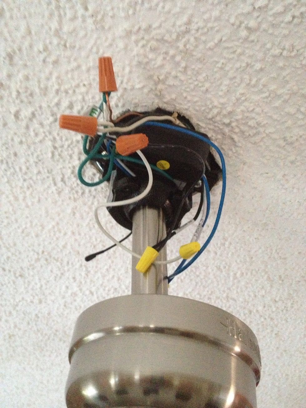 Once the box is in, place all of the wires in so they fit under the cover