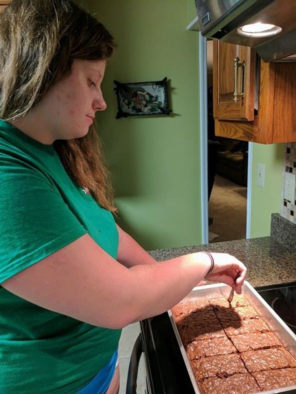 Once the brownies have cooled, grab a knife and cut the brownies into squares the size of your choice.
