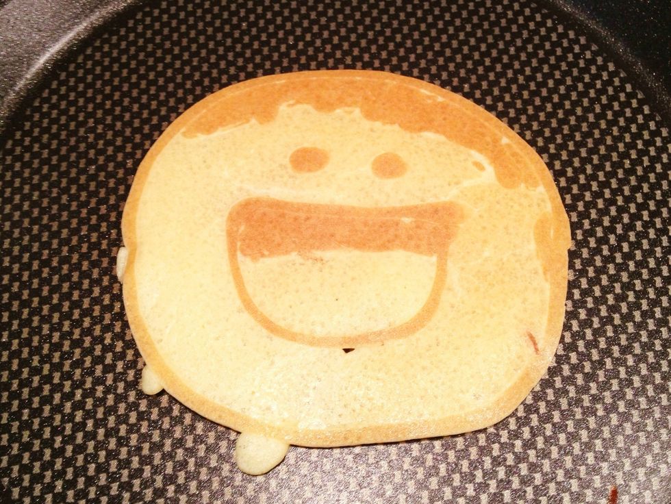 Once the bubbles break out, flip it over and smile. This is my daddy smile pancake.