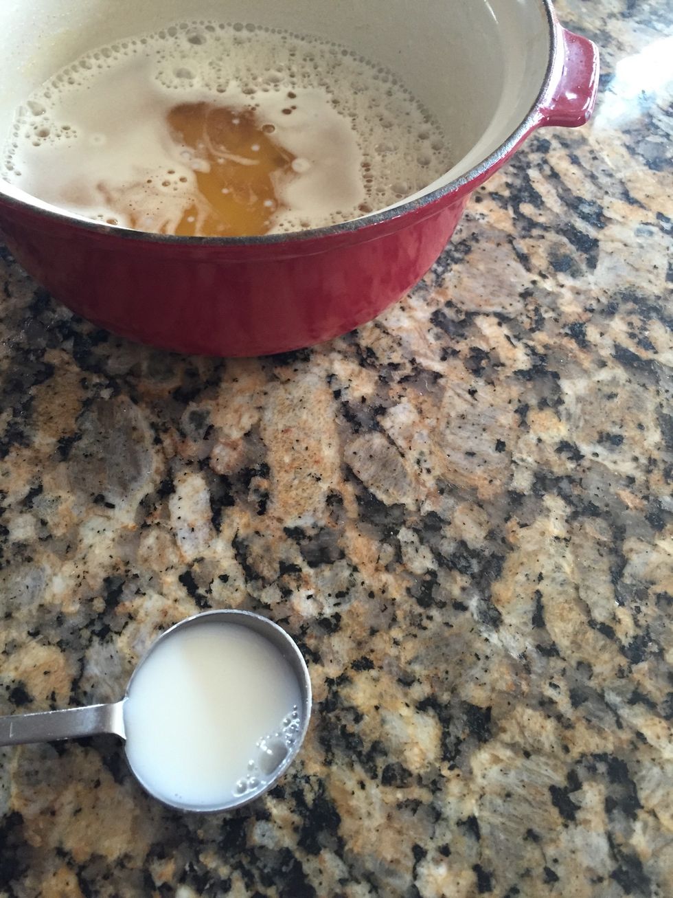 Once the butter has cooled, add 2 TB milk and 2 tsp vanilla, to the butter