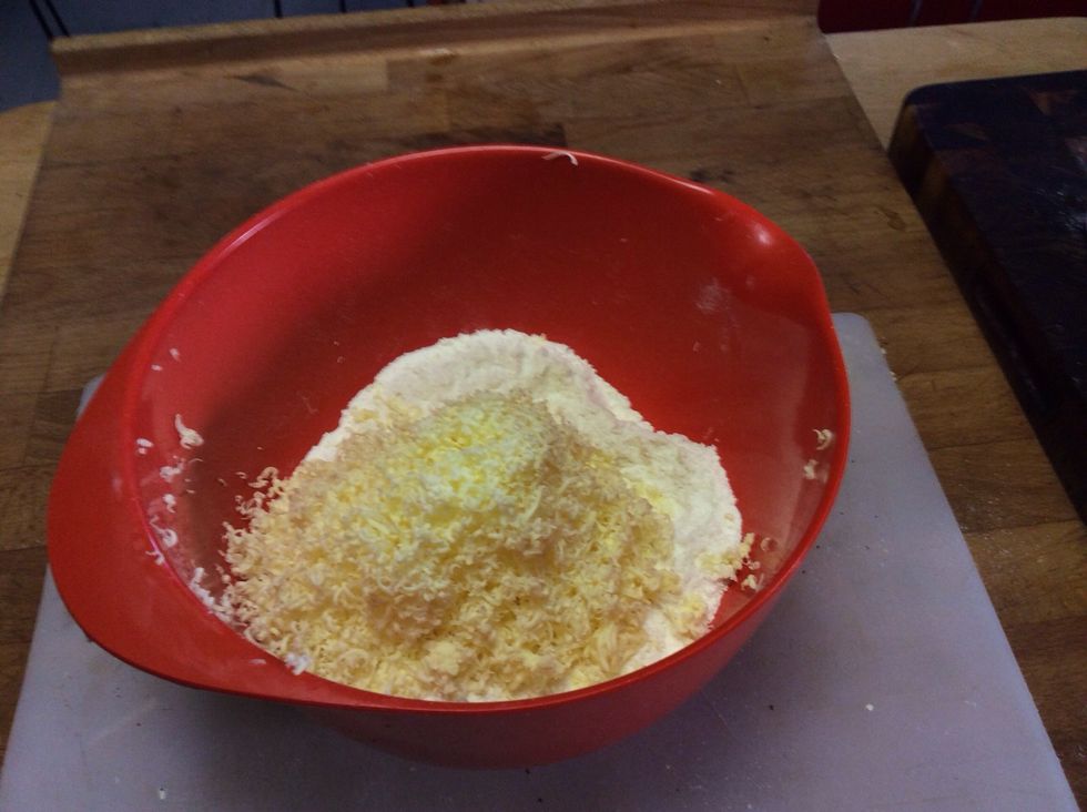 Once the butter is all grated, mix in, and using your fingers, squish it into the flour to combine. Do this until the butter is in tiny coarse granules