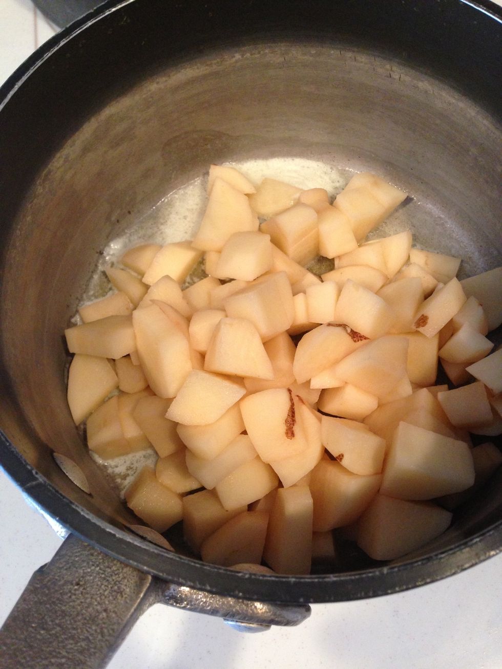 Once the butter is melted pour in your potatoes.
