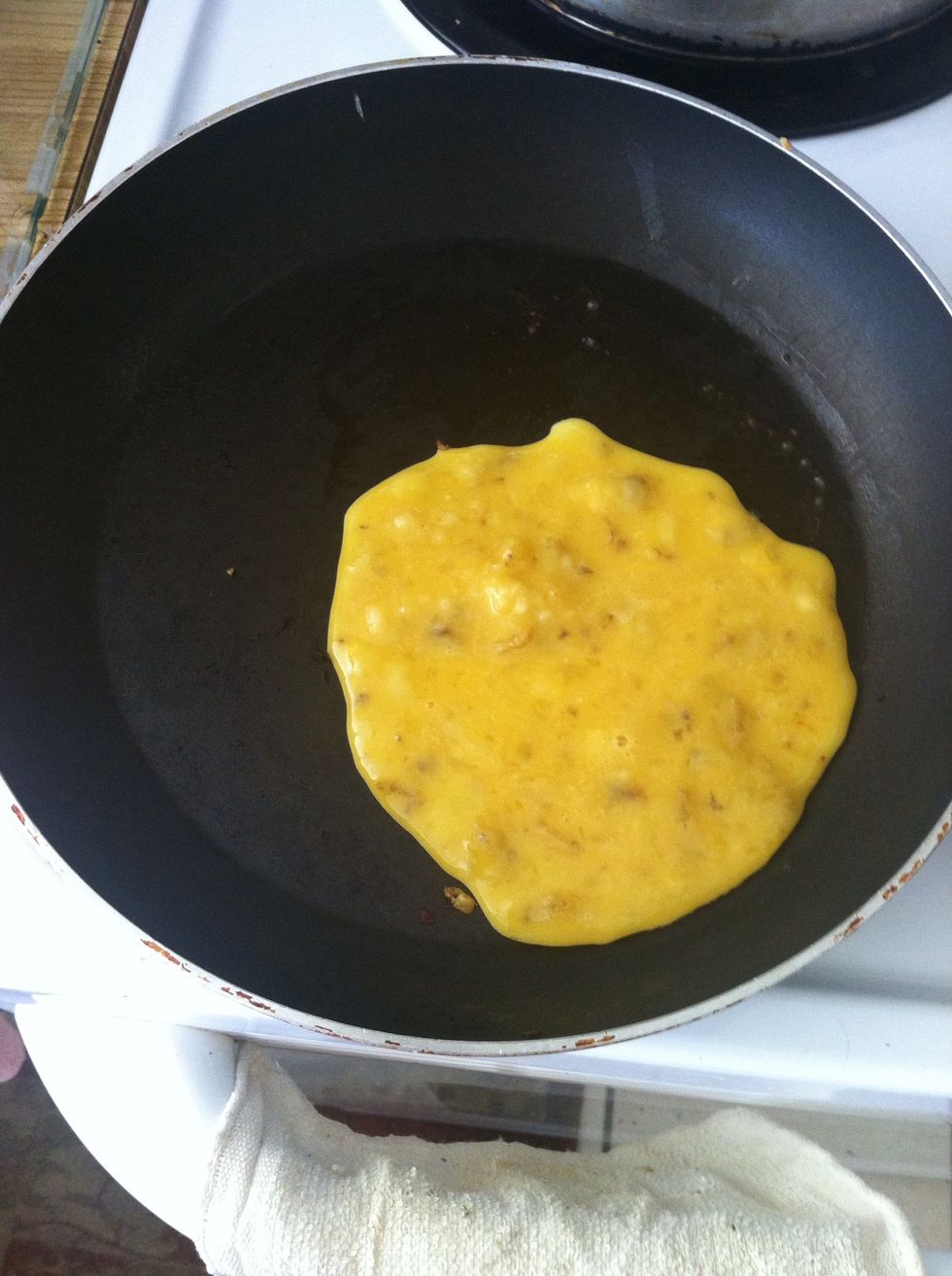 Once the butter is melted pour the banana pancake batter into the pan. Pour as much as you want depending on how big you want it. With this size I made 3!