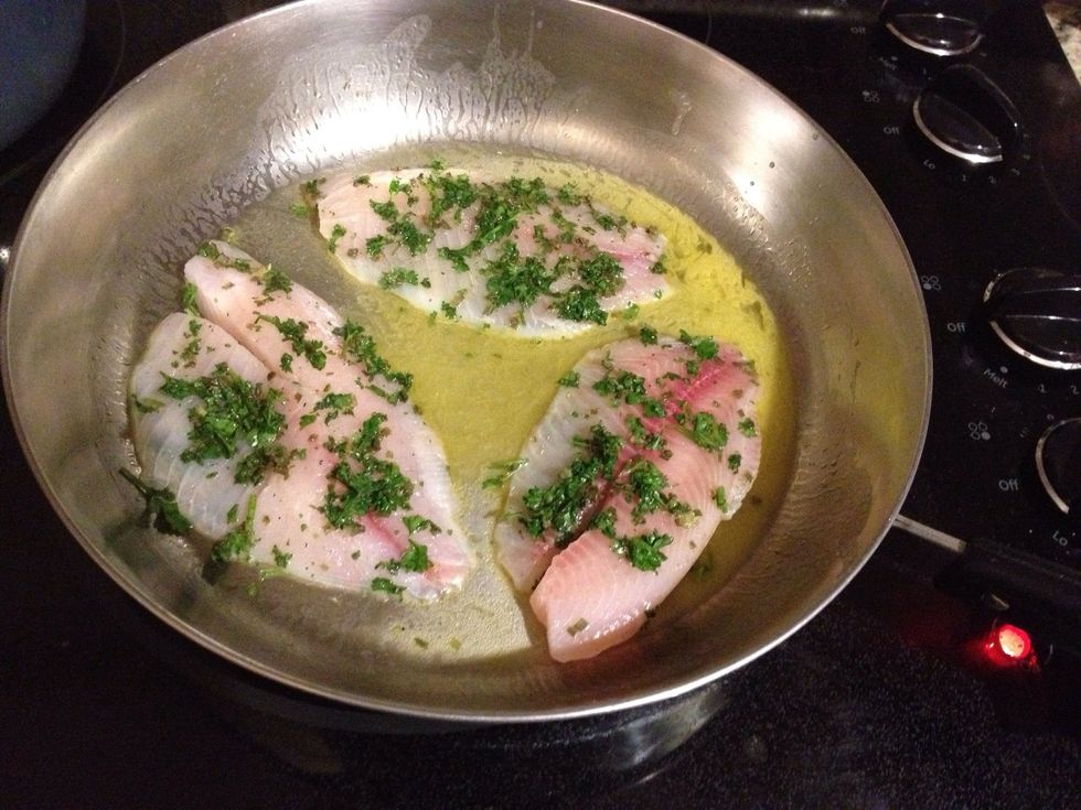 Once the butter is melted, roll the tilapia in the parsley mixture and place in the skillet. Cook for 5-7 minutes.