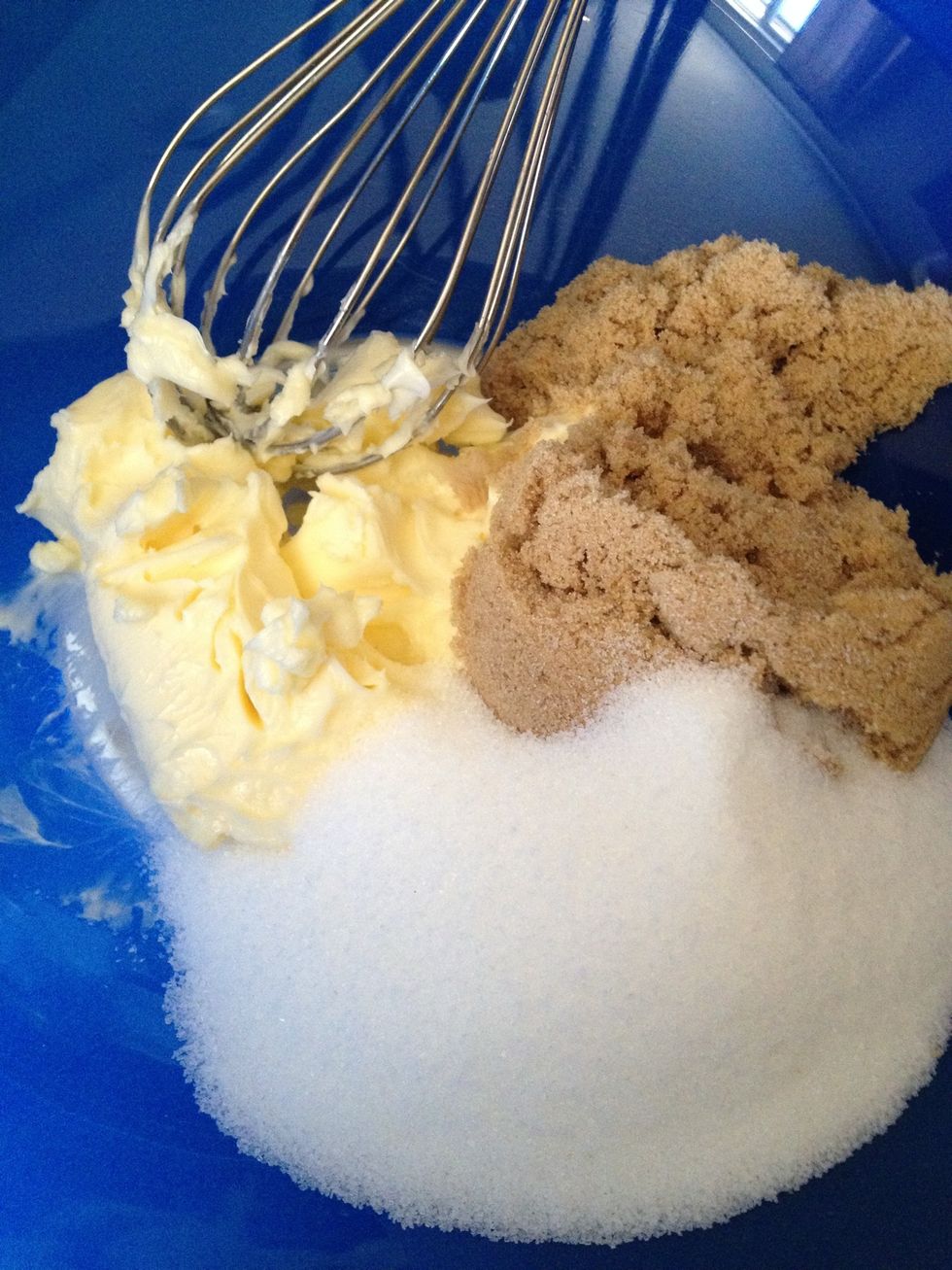 Once the butter is soft, add 1/2 a cup to a mixing bowl along with 1 cup of sugar. I use half light brown sugar and half white as a personal preference. Feel free to omit the brown sugar for all white