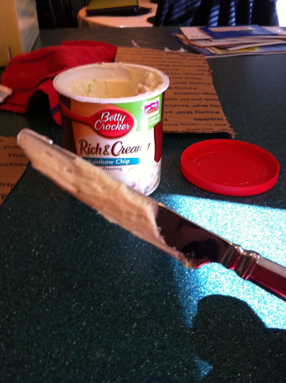 Once the cake is cool to the touch, frost it with a butter knife with a back and fourth motion until you are satisfied with how much of it there is.