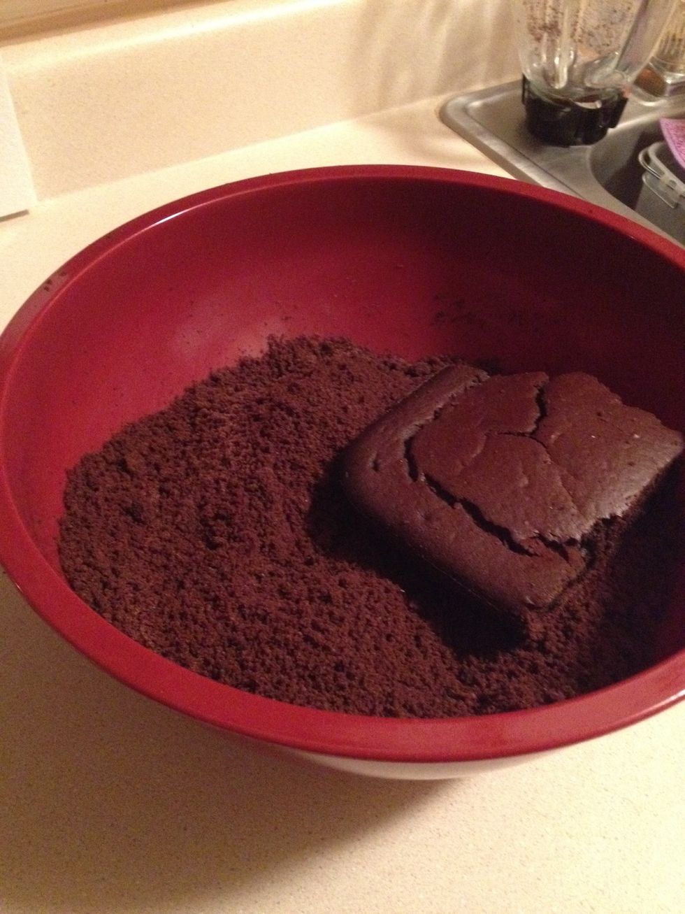 Once the cake is cooled, break it, & rub the two pieces together over a large bowl until crumble is a fine texture.