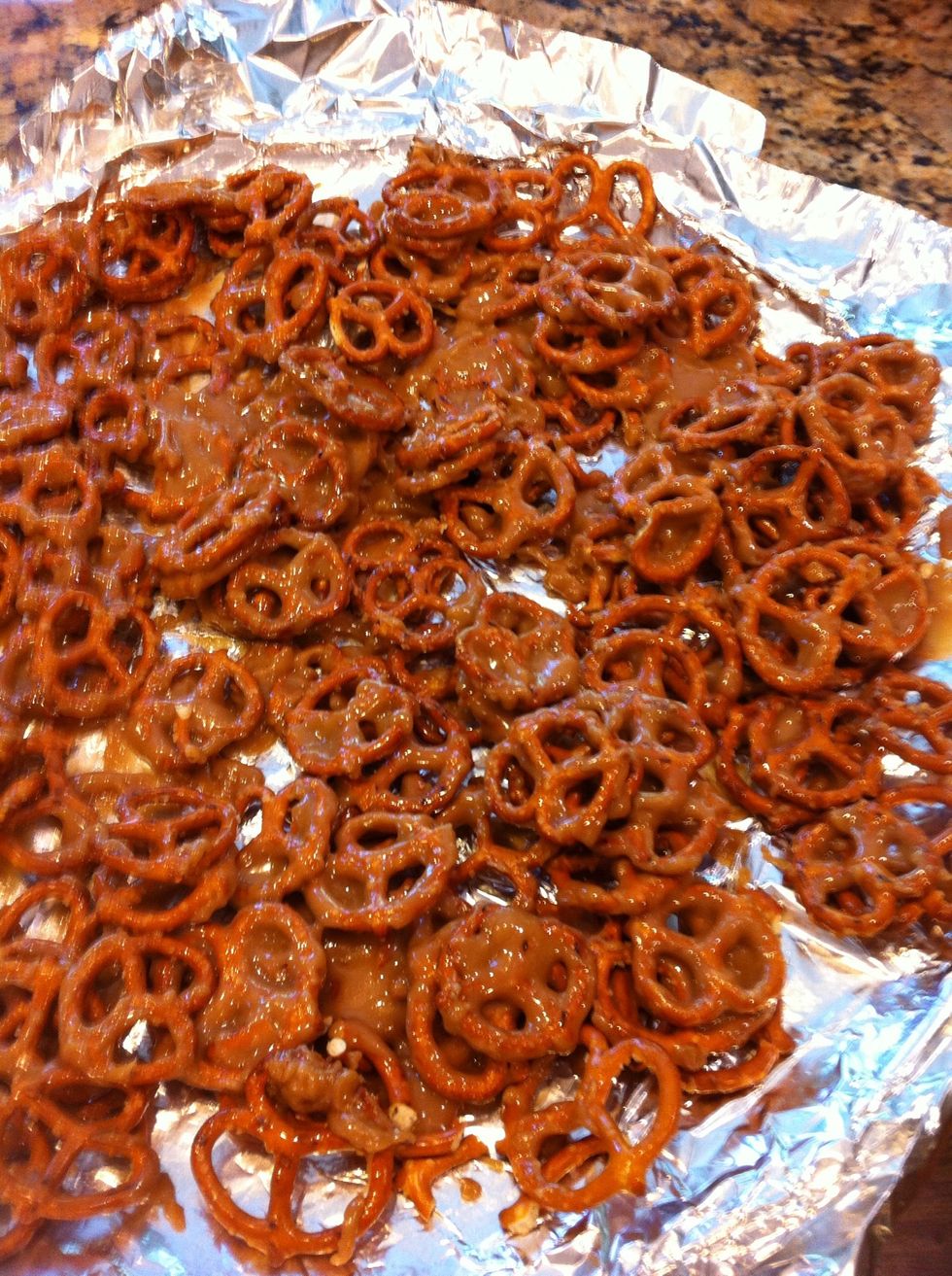 Once the caramel looks thick and gooey, remove from heat. Add tsp of vanilla. Pour over the pretzels. I stir up the pretzels a little just to coat more evenly