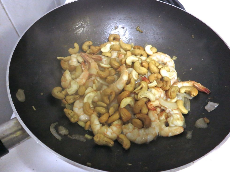 Once the Cashew nuts are slightly cooked add the Shrimp and stir.  Add Oyster Sauce and simmer for about a minute.  (Note: if the sauce is salty add 1/2 cup of water)