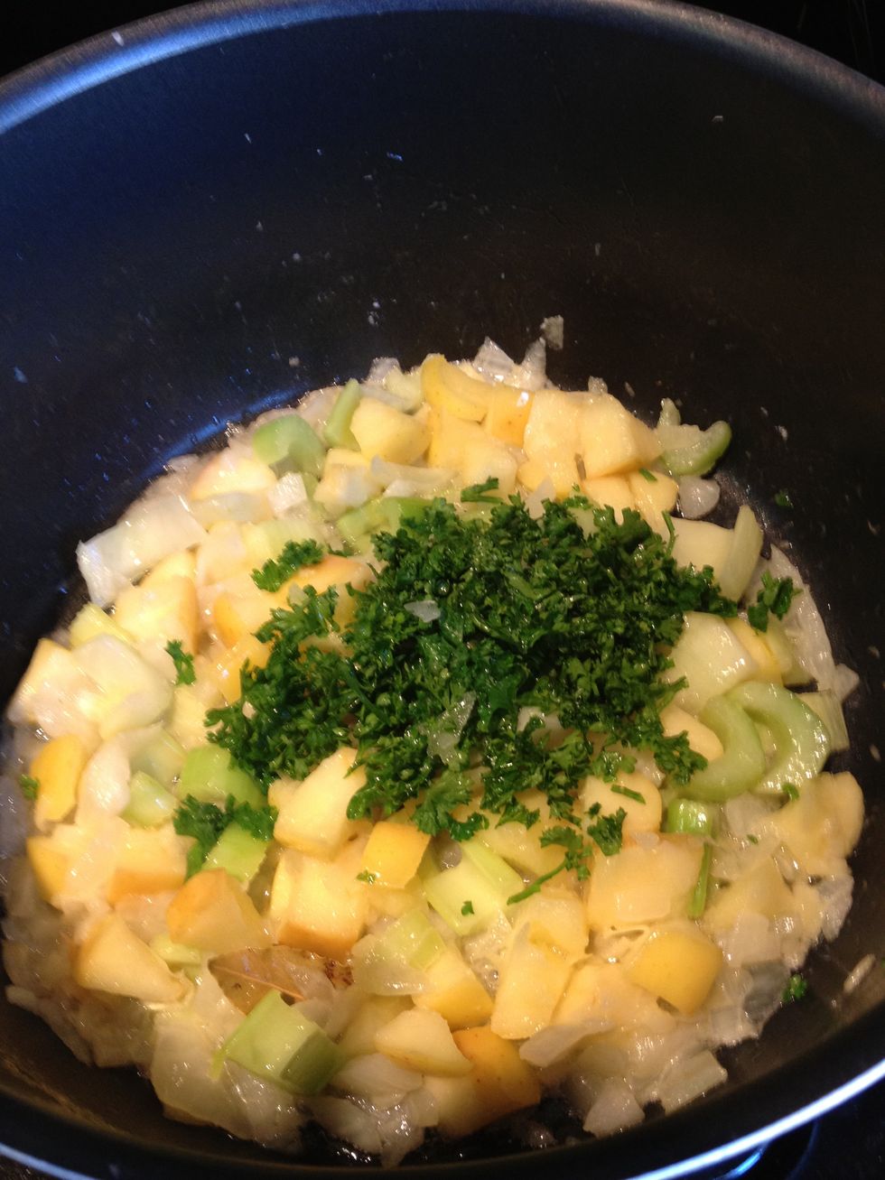 Once the celery is soft, add parsley.