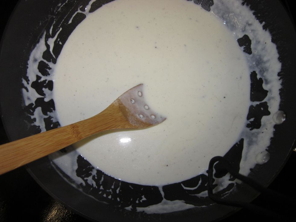 Once the cheeses are mixed in, add salt, pepper, and nutmeg to taste.