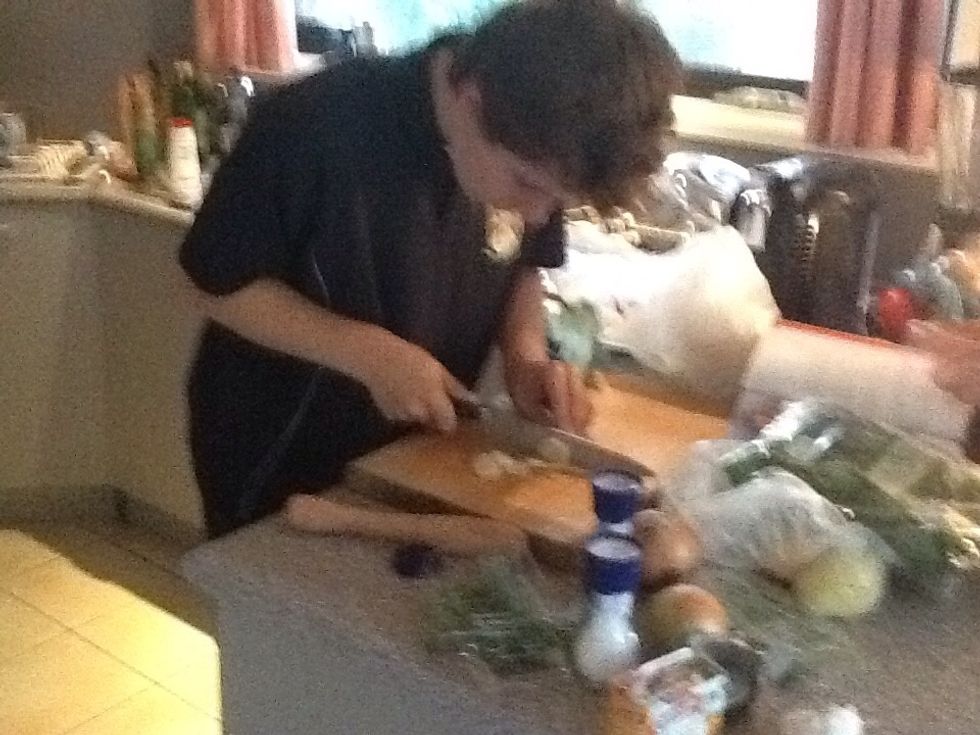 Once the chicken and the bacon have been cooked, start chopping up your leek into thin slices.