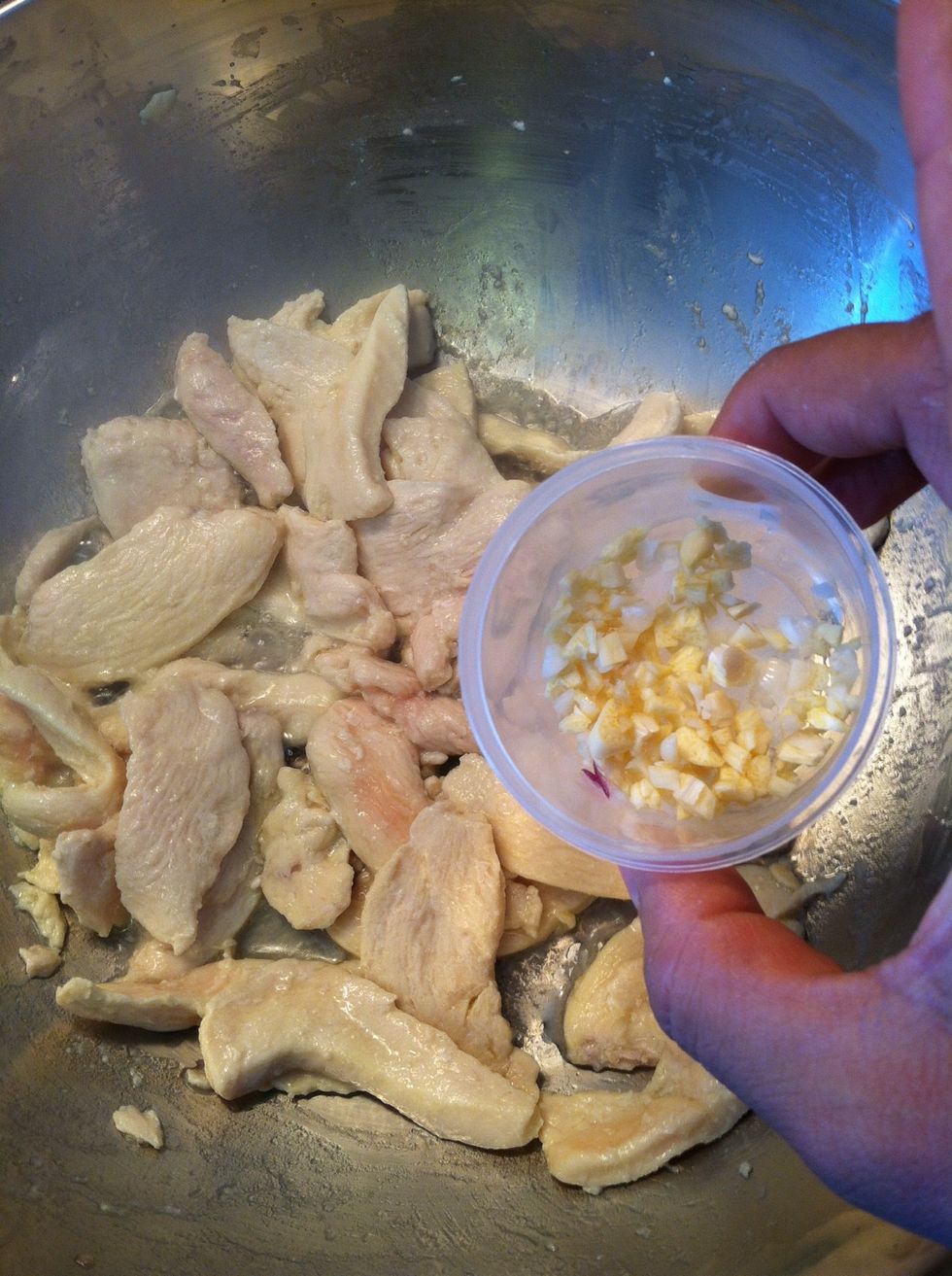 Once the chicken is almost done, and there is very little pink on the chicken, throw your fresh garlic in there and stir for a bit.