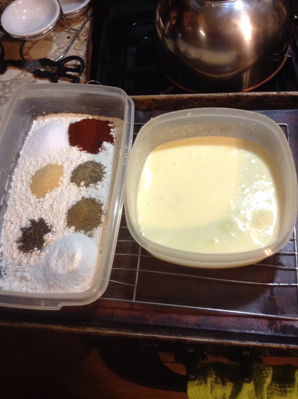 Once the chicken marinated for a minimum of one hour, gather your ingredients to coat and fry your chicken. Place all dry in a container and your wet in another container.