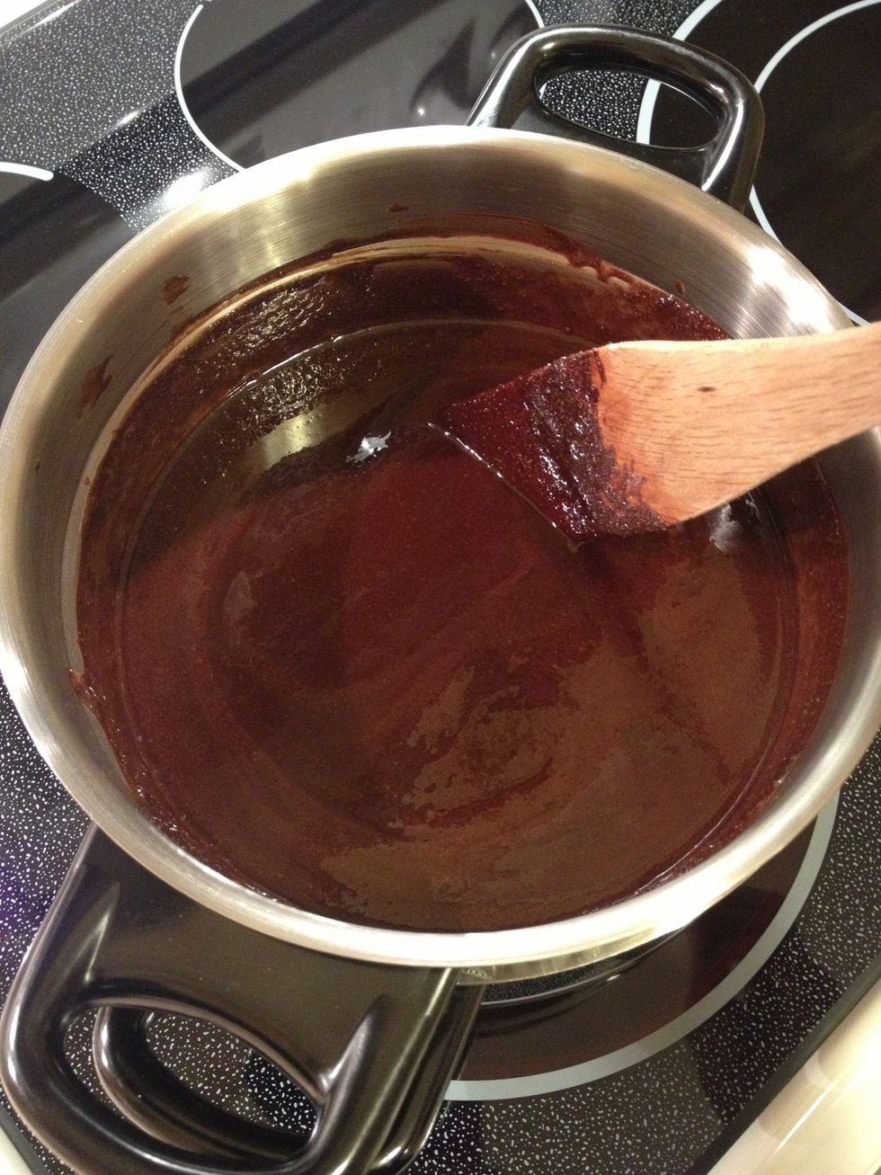 Once the chocolate and butter is melted, gradually add in the sugar and stir until everything has melted completely and the sugar is not longer grainy. This may take a few minutes.