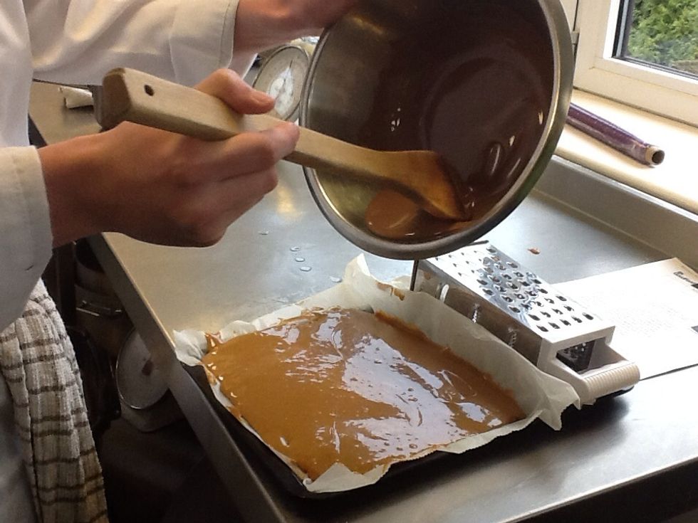 Once the chocolate is melted, pour onto the shortbread cover in the caramel.