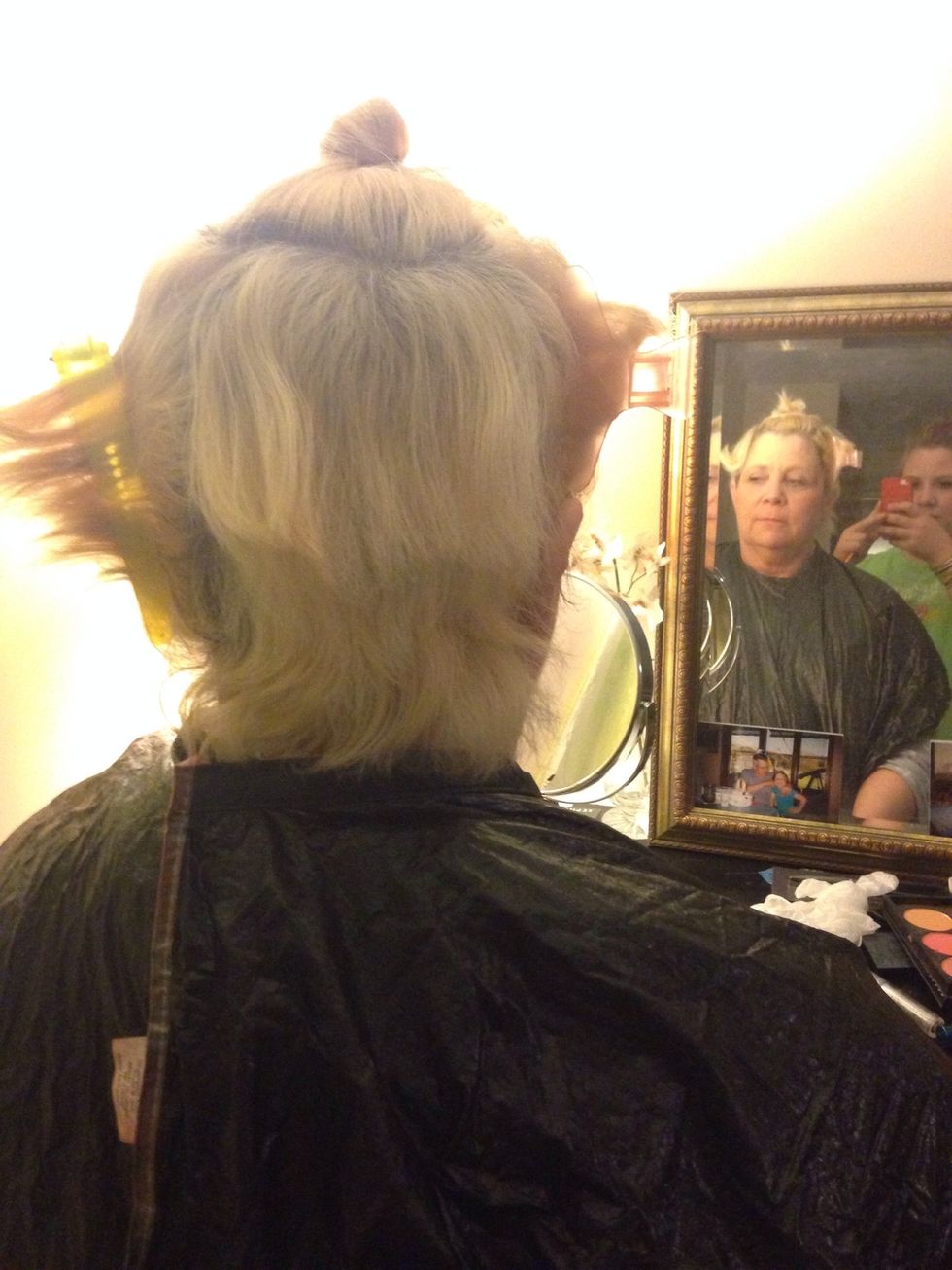 Once the color has been mixed, it is time to start the fun part the application. Start by sectioning the hair into five sections, two in the back of the head, two on either side, and one in the crown.