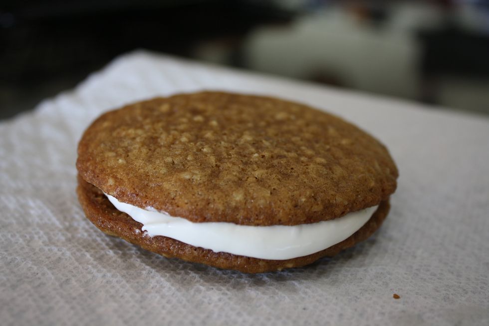 Once the cookies have cooled, pull the chilled creme out and place a spoonful between each set of cookies. Press down lightly to spread it out. Enjoy!