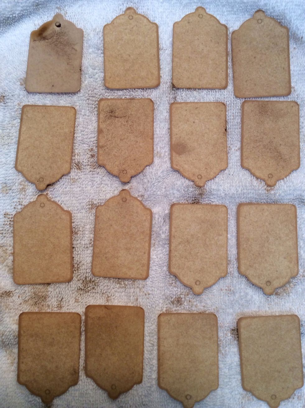 Once the desired color is achieved, remove tags and layout on old towels to dry. (Need them NOW?!?Lays tags on a paper towel placed on a paper plate, microwave for about a minute).