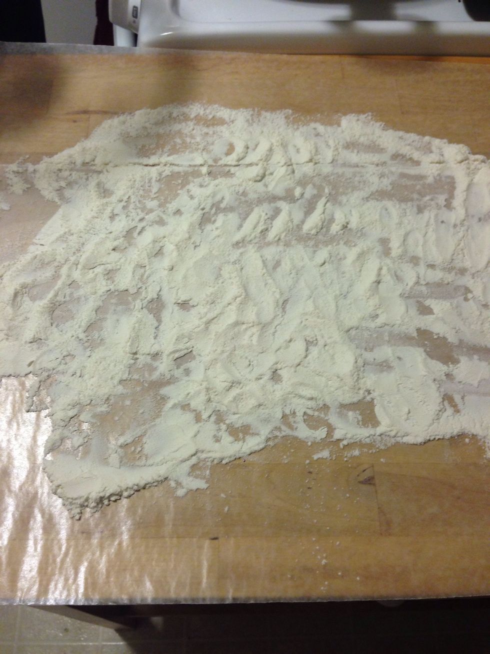 Once the dough has risen, flour an area to roll out the dough.