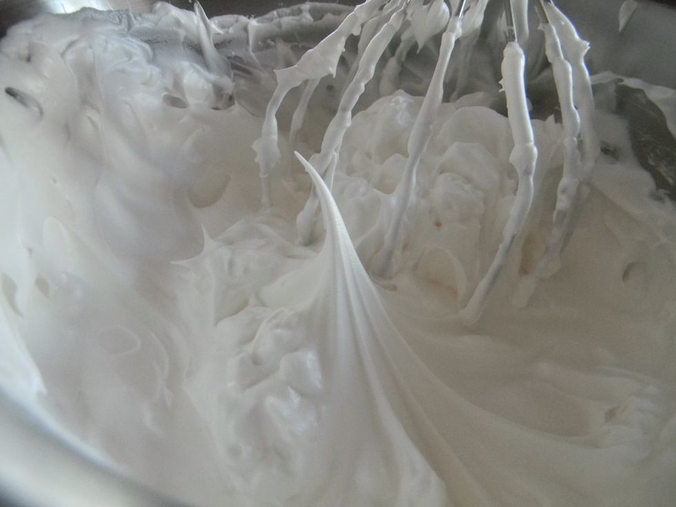 Once the egg whites are frothy add in the rest of the sugar and beat for approx. 5 minutes until a stiff peak forms when you remove the whisk. Be careful not to beat for too long.