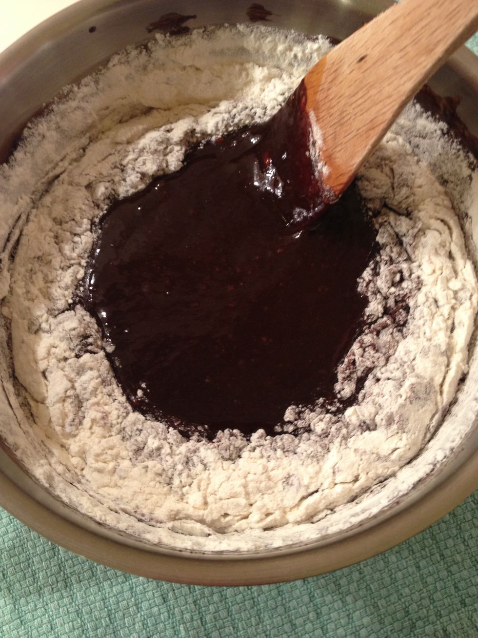 Once the eggs are mixed in, add the flour and salt mixture.